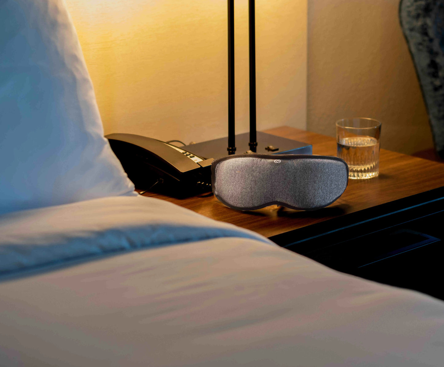 Lumos Smart Sleep Mask on the Bedside Table