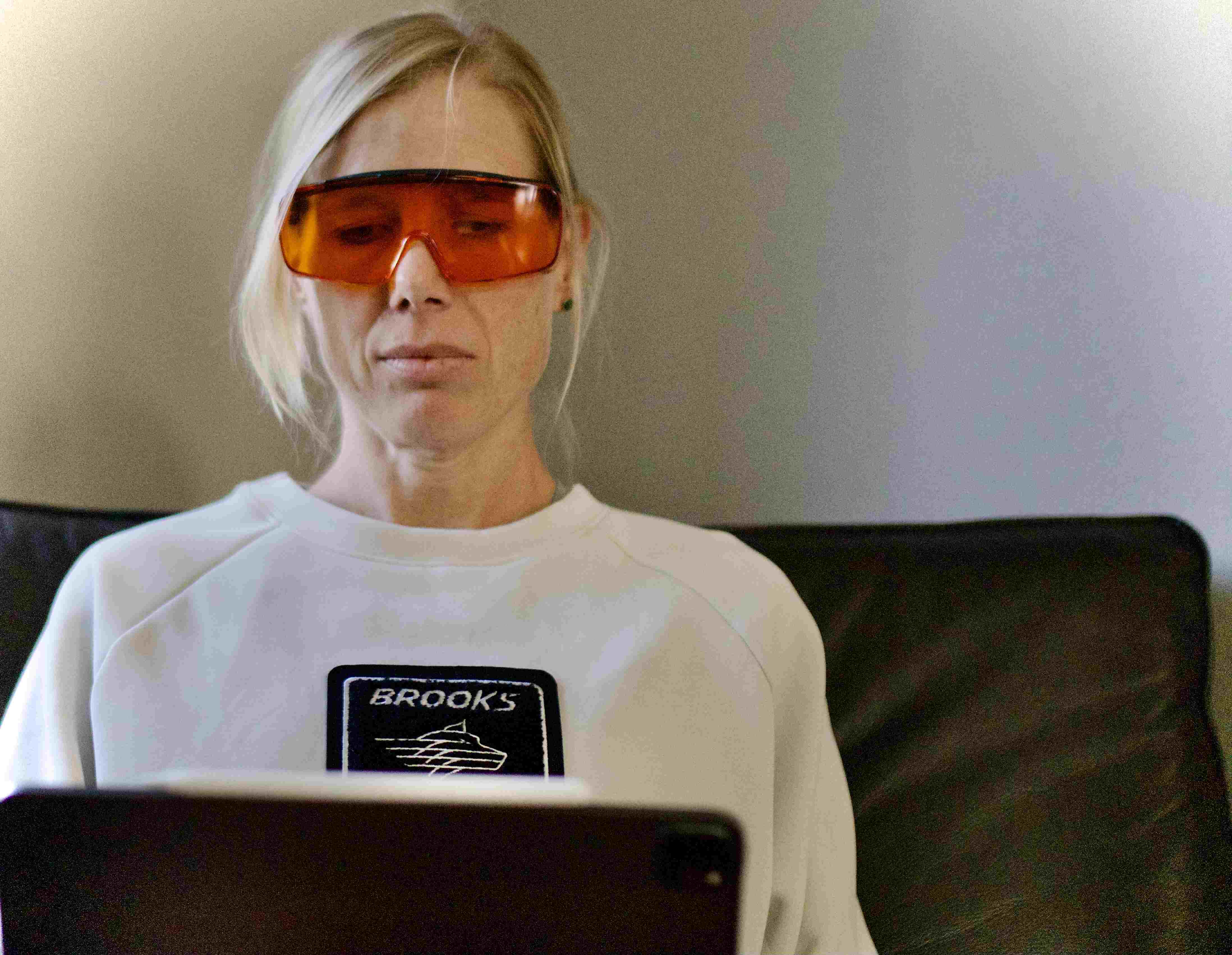 Image of a Woman Wearing the Lumos Blue Blocker, the Blue Light Blocking Goggles.