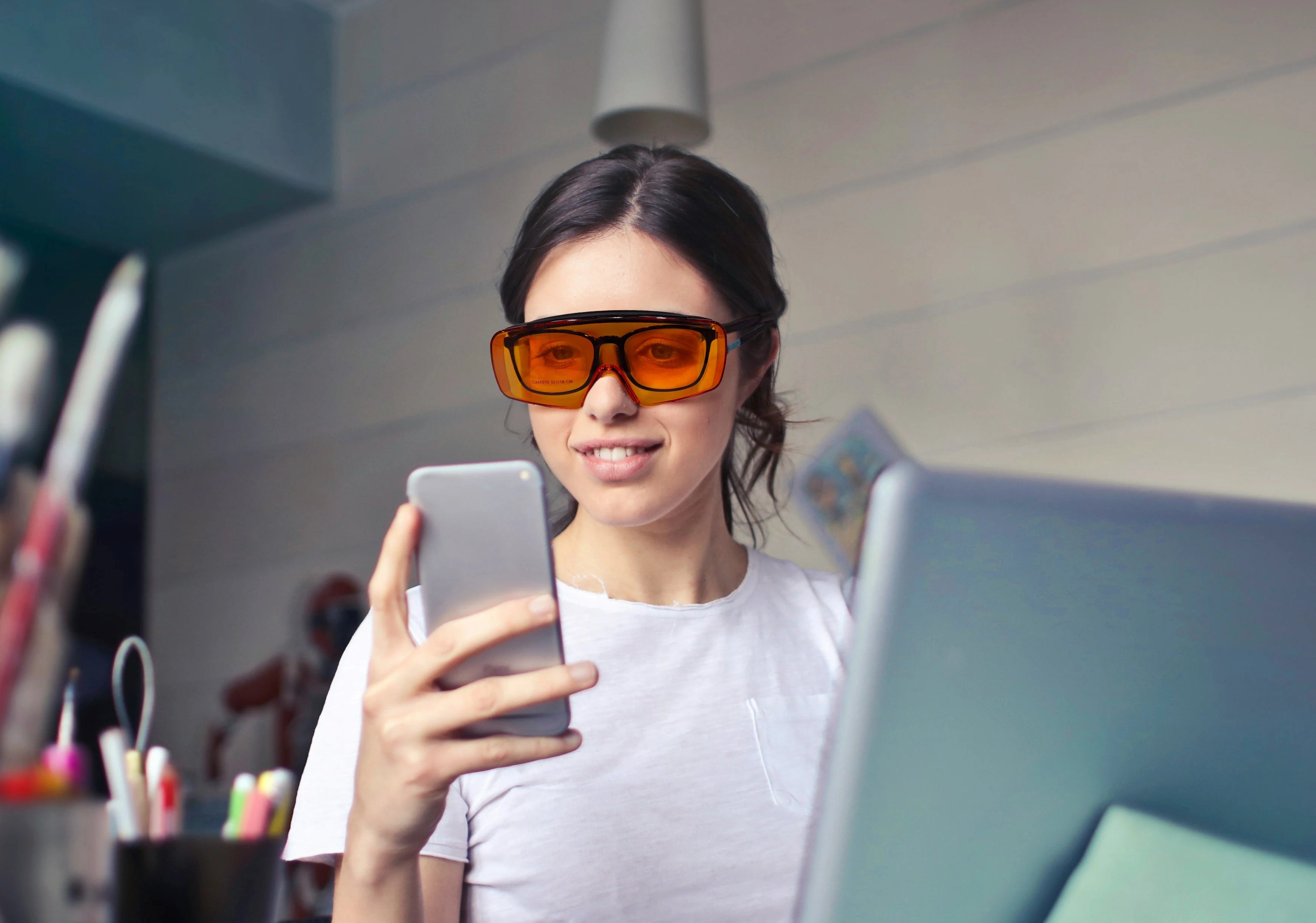 Image of a Woman Wearing the Lumos Blue Blocker, the Blue Light Blocking Goggles.